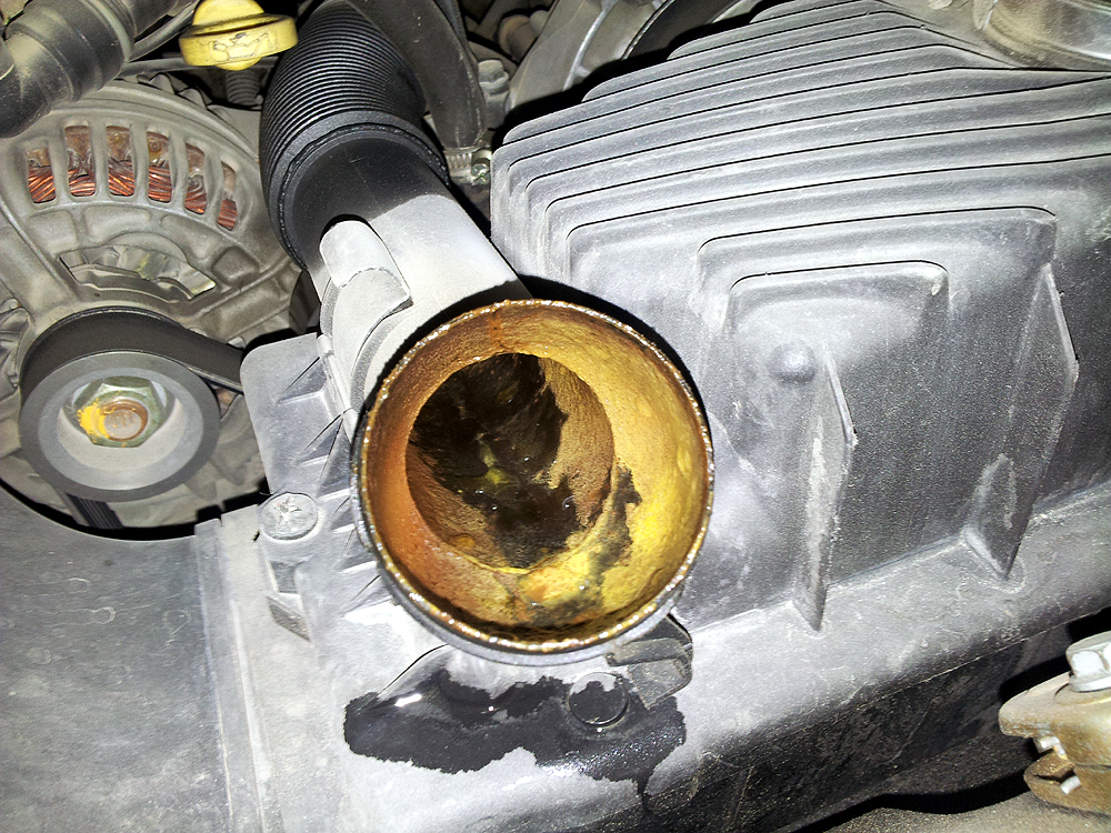 oil in coolant reservoir problems