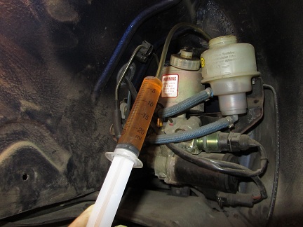 Name:  13-IMG_1416-0.1-removing-all-brake-fluid-from-the-reservoir.jpg
Views: 2335
Size:  63.2 KB