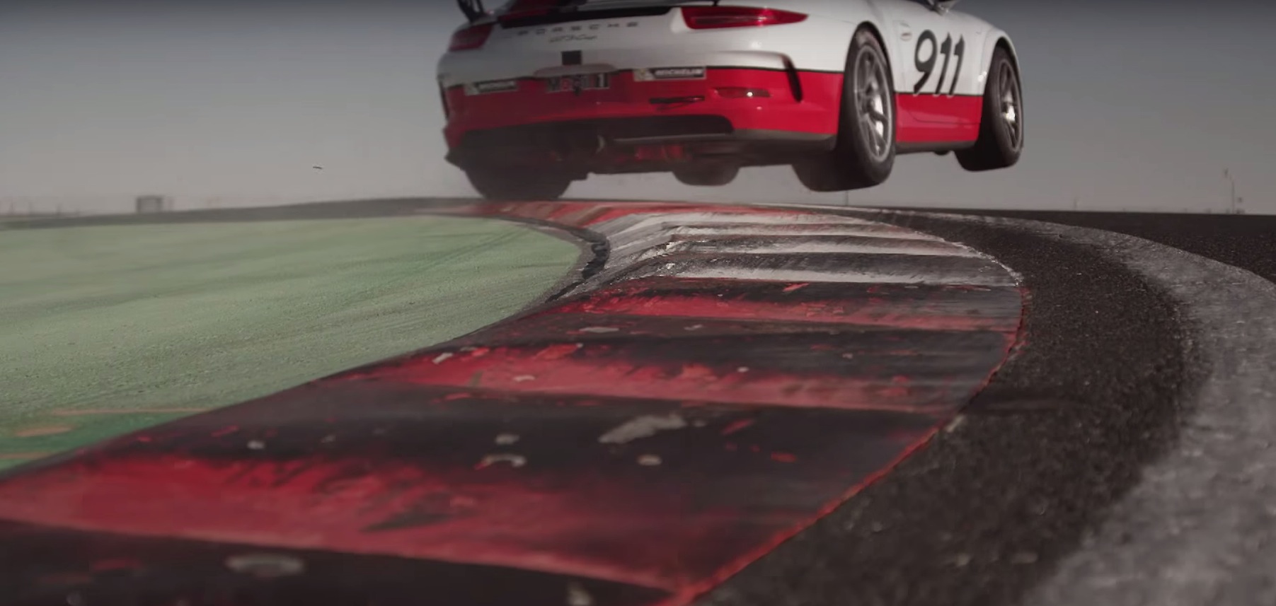 mark-webber-jumps-porsche-911-gt3-cup-spins-off-the-track-while-texting-in-cool-safety-ad-video-101969_1