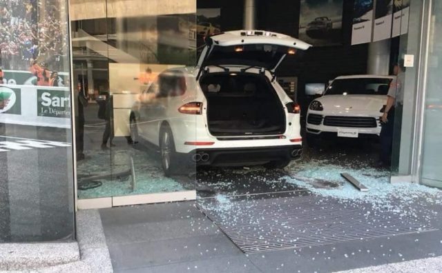 Man Deliberately Crashes Porsche Cayenne Into Dealership